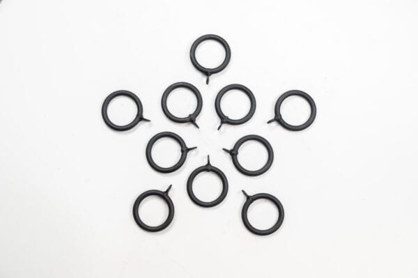 Ten Standard Curtain Rings in black, arranged geometrically on a white background.