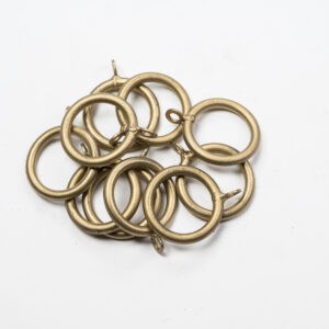 Standard Curtain Rings scattered randomly on a white background.