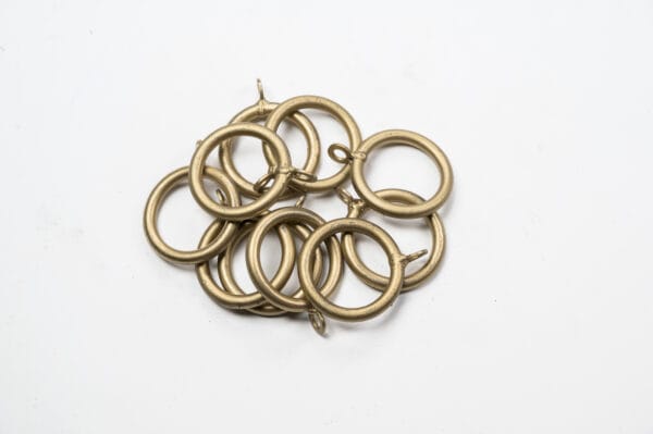 Standard Curtain Rings scattered randomly on a white background.
