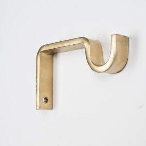 A gold wall-mounted Classic Center Support Bracket with a curved design against a white background.