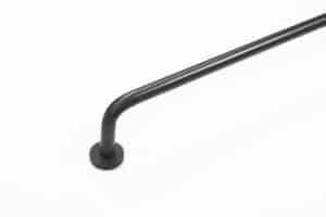 A black metal handrail with a rounded end resembles sleek curtain rods, mounted against a crisp white background.