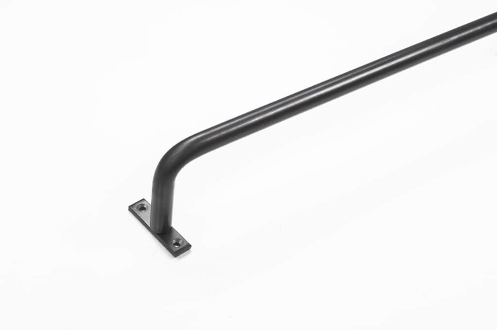 Black metal handrail attached to a rectangular base against a plain white background.