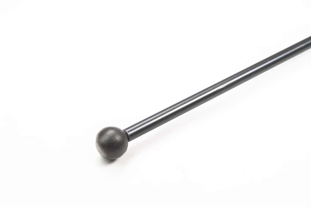 A black metal rod with a round ball at one end, isolated on a white background.