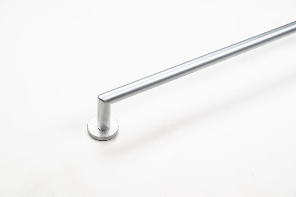 Metal rod attached to a round base, positioned diagonally on a white background.